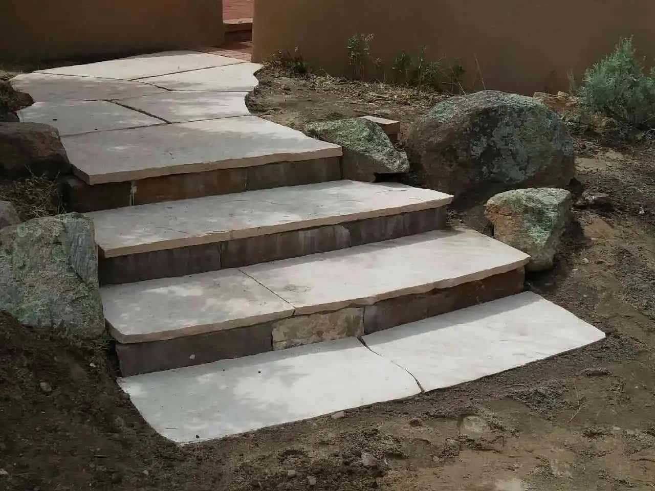 Modern outdoor steps featured in a Santa Fe landscaping design